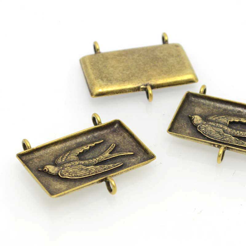 Swallow Bezel Antique Brass Each