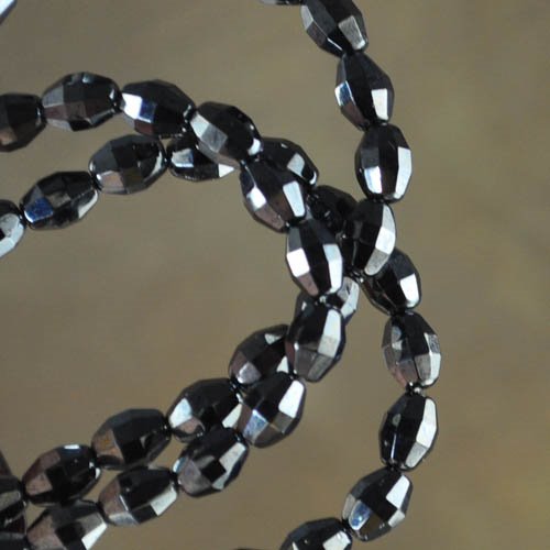 Fire Polish - 5x7mm - Faceted Olive - Gunmetal (strand)