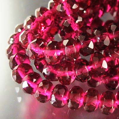Fire Polish - 7mm - Faceted Donut - Cranberry (strand 25)
