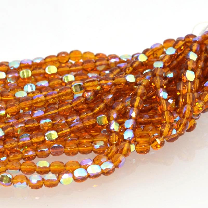 Fire Polish - 6mm - TwoWay Cut - Topaz AB (strand 25)