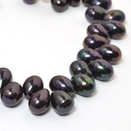 Freshwater Pearls - 9x7mm Bullet Pearl - Dark Plum Lustre Pearl (strand)